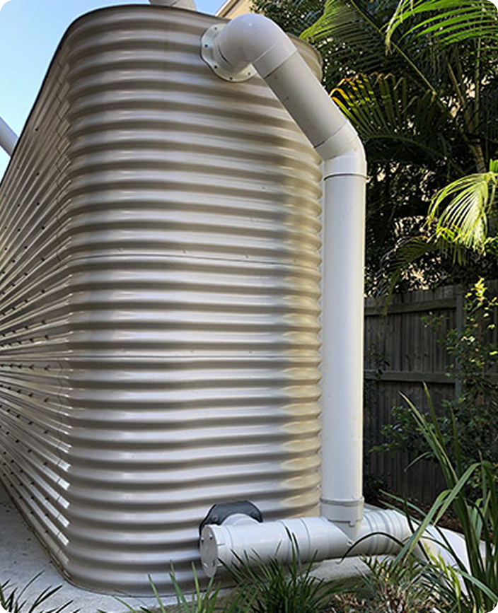 Stormwater tank with downpipe and drainage pipework