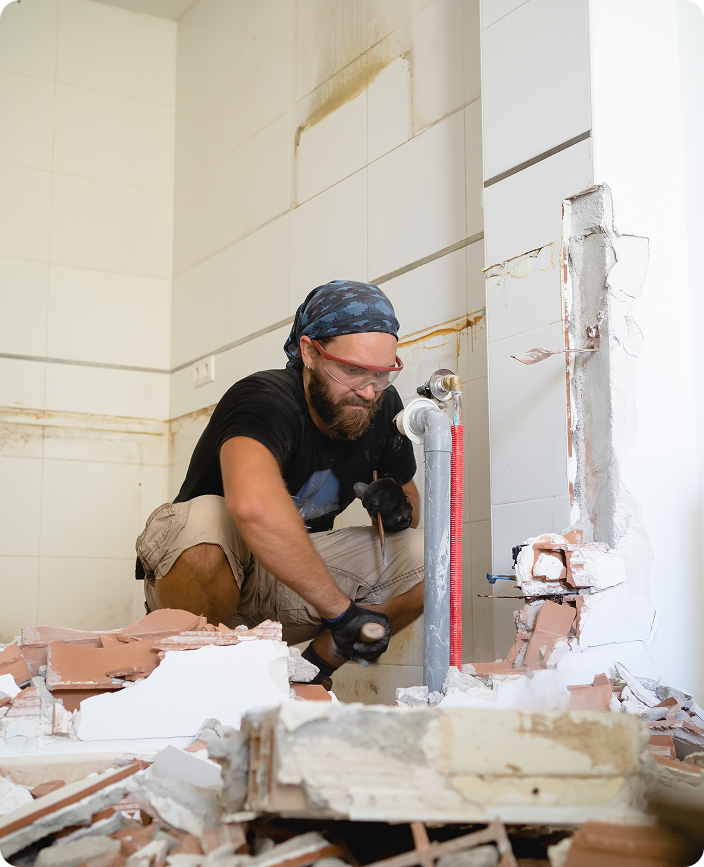 Dylsal Plumbing renovator at work in a bathroom strip-out