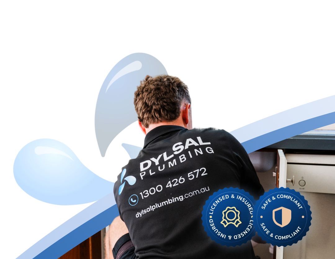 Dylsal Plumbing technician servicing a commercial grease trap